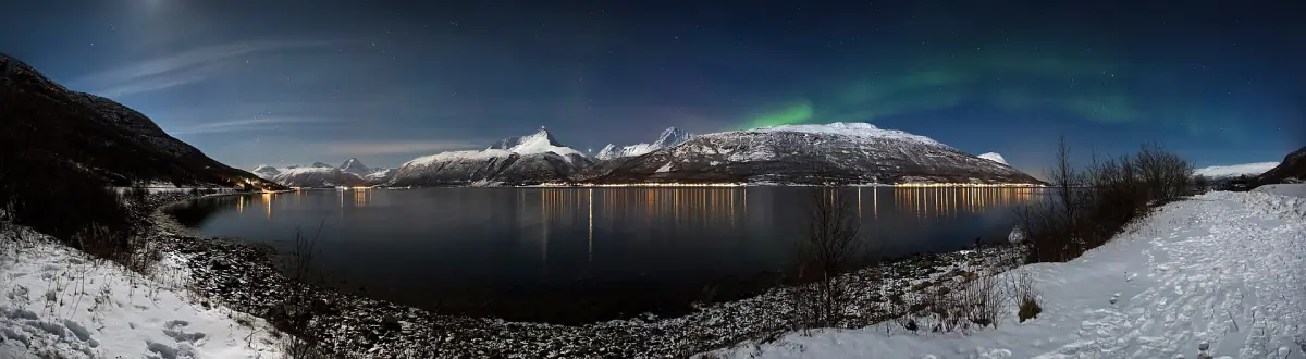 Aurora above Storfjorden and the Lyngen Alps
